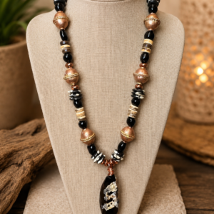Handmade African tribal chunky beaded necklace with onyx, carved bone, Ethiopian copper beads, coconut shell accents, and a black stone pendant