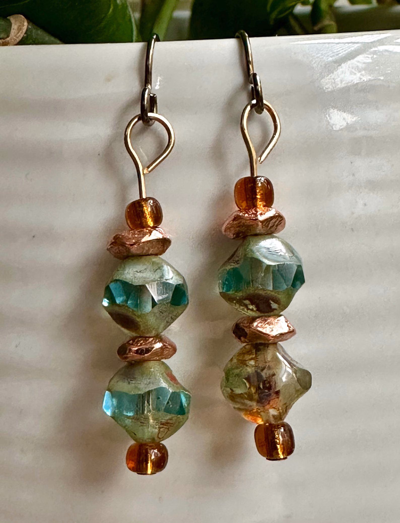 Front view of boho Czech glass and copper beaded drop earrings with niobium ear wires.