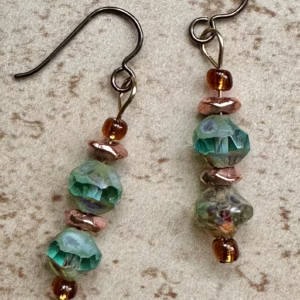 Handcrafted blue-green Czech glass and copper drop earrings with hypoallergenic niobium ear wires by Boho By Shae