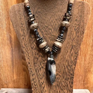 Handmade African tribal men's beaded necklace featuring a large polished agate pendant with bone beads and artisan African metal beads.