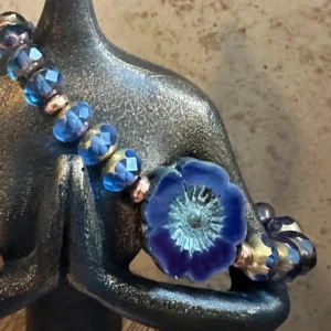 Handmade Czech tanzanite fire-polished bead bracelet featuring a Czech glass flower focal bead, copper accents, and artisan glass beads.