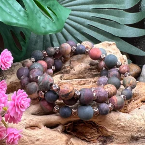 Stacked view of handcrafted natural multi-color jasper and copper stretch bracelets by Boho By Shae