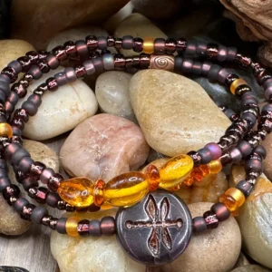 Handcrafted purple wrap bracelet featuring genuine amber, Czech seed beads, and a dragonfly charm by Boho By Shae